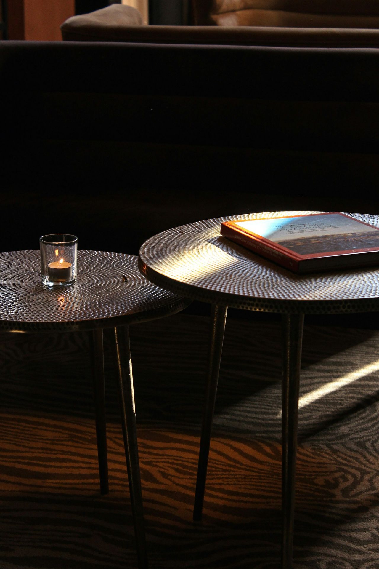 A couple of tables sitting on top of a wooden floor